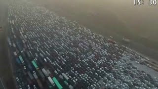 Watch the incredible footage of a 50lane holiday traffic jam in China [upl. by Ocirema]