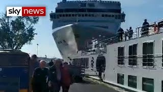 Cruise ship crashes into dock and tourist boat in Venice [upl. by Bartko]